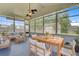 Cozy sunroom with outdoor seating, dining table, and plenty of natural light, perfect for entertaining at 334 Cicadas Song Dr, Moncks Corner, SC 29461