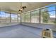 Enclosed sunroom with ample natural light, screened windows, and a view of the backyard at 334 Cicadas Song Dr, Moncks Corner, SC 29461