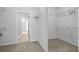 Spacious walk-in closet featuring neutral carpet, built-in wire shelving and easy access to other rooms of the home at 334 Cicadas Song Dr, Moncks Corner, SC 29461