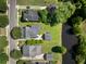 An aerial top shot view shows the property and surrounding neighborhood with mature trees and water at 3426 Acorn Drop Ln, Johns Island, SC 29455