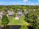 An aerial view showcases the property's location near lush greenery and a peaceful waterway at 3426 Acorn Drop Ln, Johns Island, SC 29455