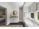 Bright bathroom featuring a soaking tub, glass-enclosed shower, granite-topped vanity, and neutral tile flooring at 3426 Acorn Drop Ln, Johns Island, SC 29455