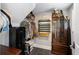 Unique closet space for sporting equipment with custom gun display and ample camouflage garment storage at 3426 Acorn Drop Ln, Johns Island, SC 29455