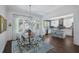 A beautifully decorated dining room open to a modern kitchen, perfect for entertaining and Gathering gatherings at 3426 Acorn Drop Ln, Johns Island, SC 29455