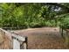 Fenced dog park with trees and shaded areas and a convenient bench at 3426 Acorn Drop Ln, Johns Island, SC 29455