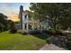 Stunning two-story home with a grand front porch and lush landscaping at 3426 Acorn Drop Ln, Johns Island, SC 29455
