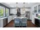 A well-lit kitchen featuring white cabinets, stainless steel appliances, and a stylish center island at 3426 Acorn Drop Ln, Johns Island, SC 29455