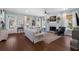 Bright living room with fireplace, ceiling fan, hardwood floors, and plenty of natural light at 3426 Acorn Drop Ln, Johns Island, SC 29455