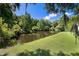 Scenic pond surrounded by lush greenery and mature trees at 3426 Acorn Drop Ln, Johns Island, SC 29455