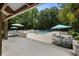 Community pool with several lounge chairs and shaded tables at 3426 Acorn Drop Ln, Johns Island, SC 29455