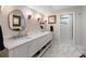 Bathroom with marble floors, double vanity, and stylish fixtures at 36 Nicholson St, Charleston, SC 29407