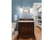 Classic bathroom with antique-style vanity, decorative mirror, and warm lighting at 36 Nicholson St, Charleston, SC 29407