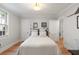 Bright bedroom with hardwood floors, neutral walls, and double closets at 36 Nicholson St, Charleston, SC 29407