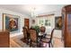 Formal dining room with an oval table, patterned chairs, and decorative artwork at 36 Nicholson St, Charleston, SC 29407