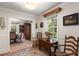 Entryway features wood floors, decorative rug, and view into the dining room at 36 Nicholson St, Charleston, SC 29407