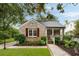 Charming brick home with mature landscaping and a welcoming front porch at 36 Nicholson St, Charleston, SC 29407