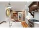 Well-appointed kitchen with white cabinetry, brick wall, and stainless steel appliances at 36 Nicholson St, Charleston, SC 29407