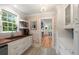 Well-lit kitchen with white cabinets, wood countertops, and decorative tile flooring at 36 Nicholson St, Charleston, SC 29407
