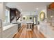 Bright and airy kitchen with hardwood floors, stainless steel appliances, and an island with seating at 36 Nicholson St, Charleston, SC 29407