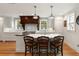 Spacious kitchen featuring a large island with seating and views of the surrounding greenery at 36 Nicholson St, Charleston, SC 29407
