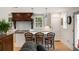 Bright kitchen with central island, stainless appliances and hood, and hardwood flooring at 36 Nicholson St, Charleston, SC 29407