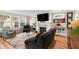 Cozy living room with a fireplace, shiplap walls, large windows, and comfortable seating at 36 Nicholson St, Charleston, SC 29407
