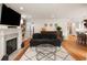 Cozy living room with fireplace, hardwood floors, and a comfortable seating area at 36 Nicholson St, Charleston, SC 29407