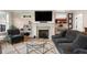 Comfortable living room featuring a fireplace, shiplap walls, a glass coffee table, and a modern rug at 36 Nicholson St, Charleston, SC 29407