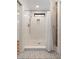 Modern bathroom with white subway tile shower and decorative floor tiles at 36 Nicholson St, Charleston, SC 29407