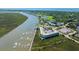 Magnificent aerial view showcases waterfront condo with boat docks and coastal charm at 3701 Docksite Rd # 220, Edisto Island, SC 29438