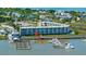 Striking aerial view showcasing the waterfront condo, nearby boat docks, and coastal community at 3701 Docksite Rd # 220, Edisto Island, SC 29438