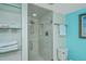 Modern bathroom featuring a glass-enclosed shower, and shelving with towels at 3701 Docksite Rd # 220, Edisto Island, SC 29438
