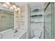 Clean bathroom features vanity with sink and shelving, toilet, and glass door shower at 3701 Docksite Rd # 220, Edisto Island, SC 29438