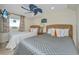 Cozy bedroom features two beds, a ceiling fan, and sunny window with view at 3701 Docksite Rd # 220, Edisto Island, SC 29438