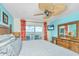 Serene bedroom featuring a ceiling fan, dresser, and balcony access offering a refreshing and relaxing retreat at 3701 Docksite Rd # 220, Edisto Island, SC 29438