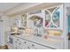 Bright and airy kitchen equipped with white appliances and great cabinet space at 3701 Docksite Rd # 220, Edisto Island, SC 29438