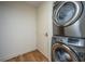 Efficient laundry space with stacked washer and dryer next to white door at 3701 Docksite Rd # 220, Edisto Island, SC 29438