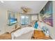 Well-appointed living room with plush seating, a TV, and access to the balcony with scenic views at 3701 Docksite Rd # 220, Edisto Island, SC 29438