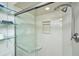 Modern shower features clear glass door, shelving, and sleek shower head at 3701 Docksite Rd # 220, Edisto Island, SC 29438