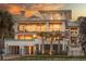 Elegant four-story home with balconies and palm trees at 3803 Palm Blvd, Isle of Palms, SC 29451