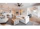 Inviting living room with a wet bar, comfortable seating, stylish decor, and a staircase leading to the upper level at 3803 Palm Blvd, Isle of Palms, SC 29451