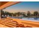 Inviting pool area with stairs and deck lights, perfect for evening relaxation at 3803 Palm Blvd, Isle of Palms, SC 29451
