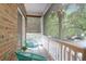 Relaxing balcony with comfortable seating and a serene view of lush trees at 4003 Radcliffe Place Dr # B6, Charleston, SC 29414