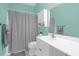 Bathroom featuring blue walls, a white vanity, a shower with a gray shower curtain, and a large mirror at 4003 Radcliffe Place Dr # B6, Charleston, SC 29414