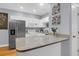 Bright kitchen featuring white cabinets, stainless steel appliances, and granite countertops at 4003 Radcliffe Place Dr # B6, Charleston, SC 29414