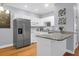Bright kitchen featuring white cabinets, stainless steel appliances, and granite countertops at 4003 Radcliffe Place Dr # B6, Charleston, SC 29414