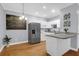 Bright kitchen featuring white cabinets, stainless steel appliances, granite countertops, and hardwood floors at 4003 Radcliffe Place Dr # B6, Charleston, SC 29414