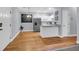 Bright open kitchen with hardwood flooring and white cabinets at 4003 Radcliffe Place Dr # B6, Charleston, SC 29414