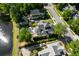 Aerial view of upscale houses showing beautiful landscaping, mature trees, and proximity to a pond at 4009 E Amy Ln, Johns Island, SC 29455