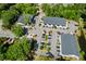 Aerial view of buildings showcasing ample parking and lush landscaping surrounding the property at 4009 E Amy Ln, Johns Island, SC 29455